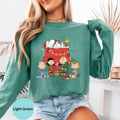 Comfort Colors® Christmas long sleeve T-shirt in Light Green with festive cartoon dog family illustration
