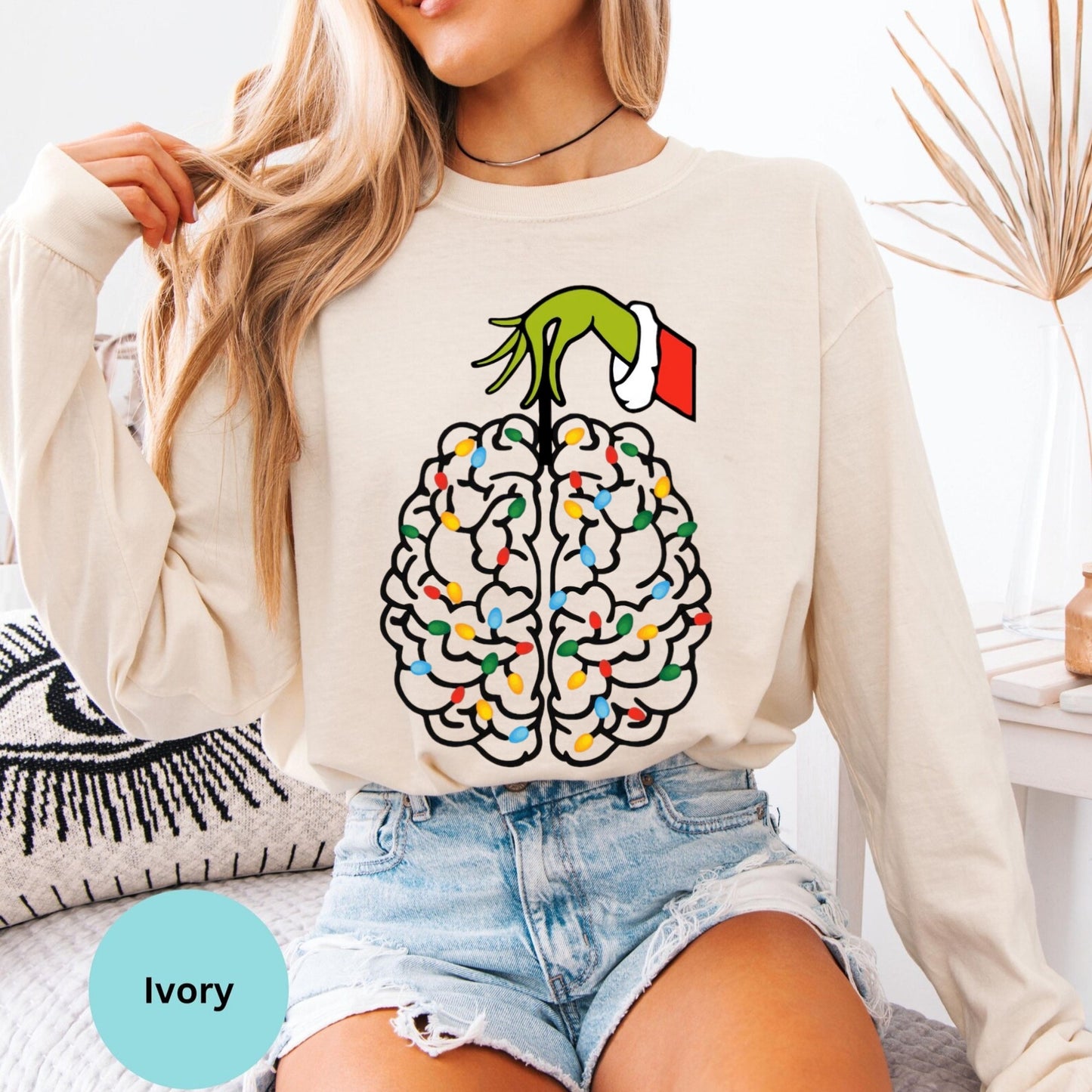 Ivory long sleeve woman wearing colorful brain graphic shirt