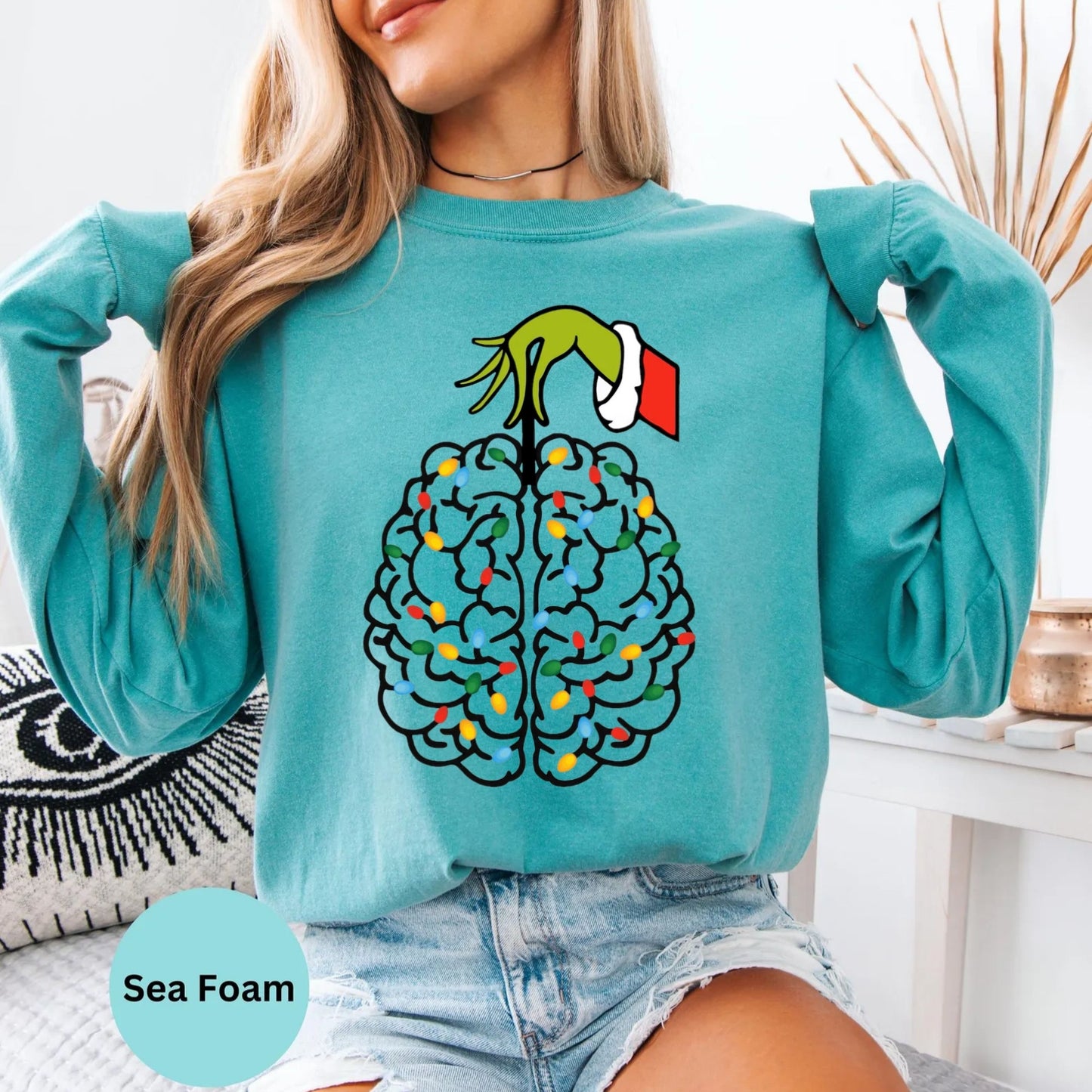 Seafoam long sleeve woman wearing colorful brain graphic design