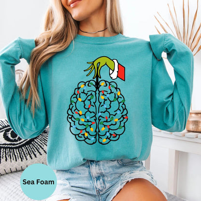 Seafoam long sleeve woman wearing colorful brain graphic design