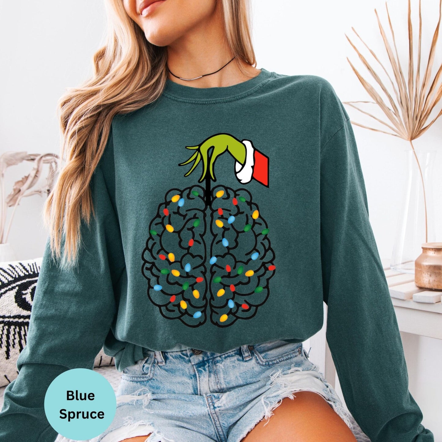 Blue Spruce long sleeve woman wearing colorful brain nurse graphic