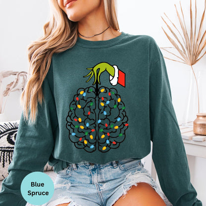 Blue Spruce long sleeve woman wearing colorful brain nurse graphic