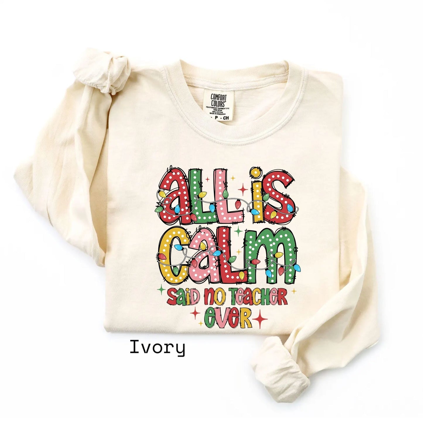 Ivory long sleeve with All Is Calm teacher Christmas graphic