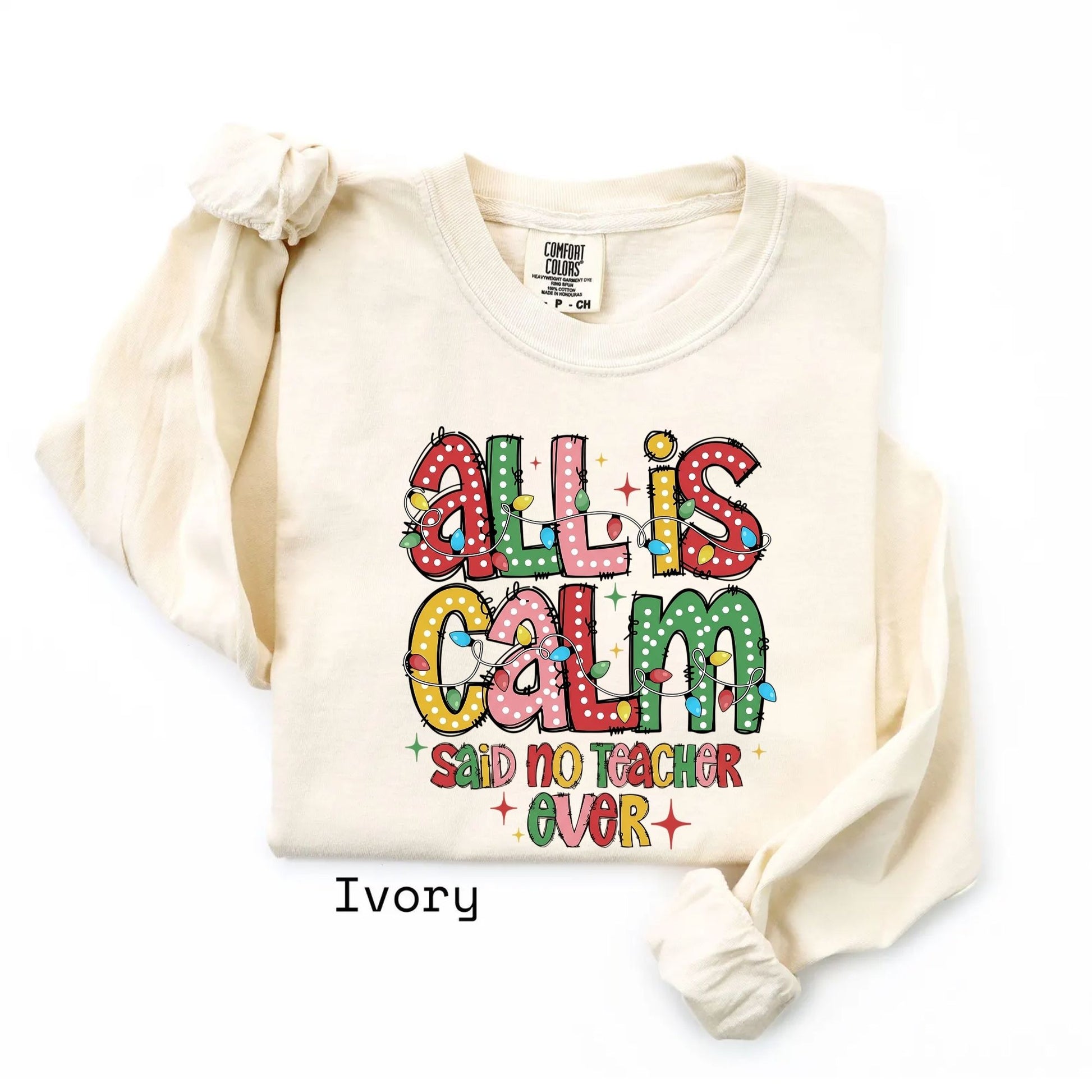 Ivory long sleeve with All Is Calm teacher Christmas graphic
