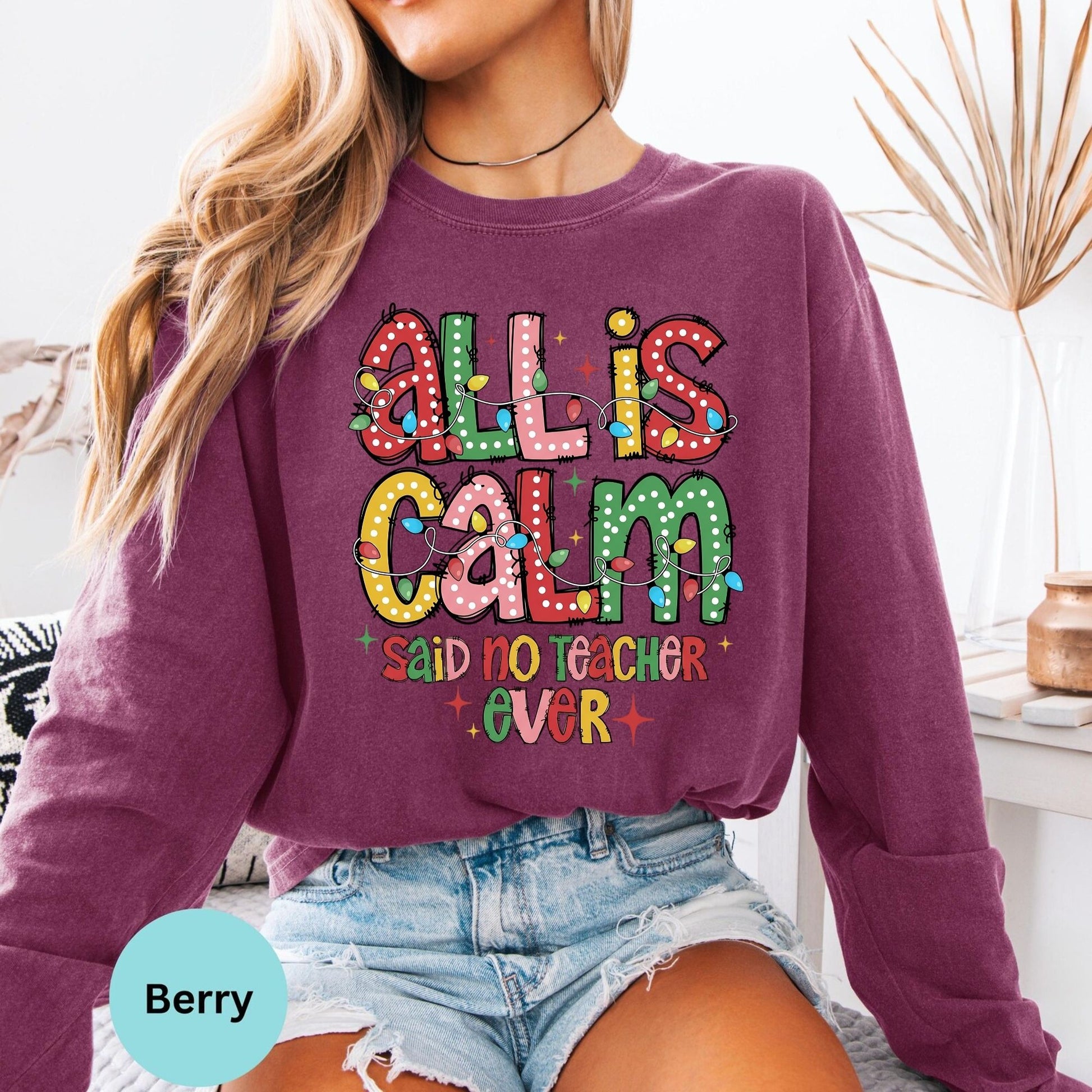 Berry long sleeve woman wearing All Is Calm teacher graphic