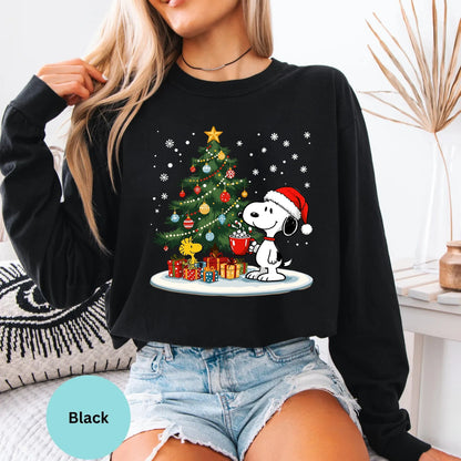 Black long sleeve woman wearing Snoopy Christmas tree graphic