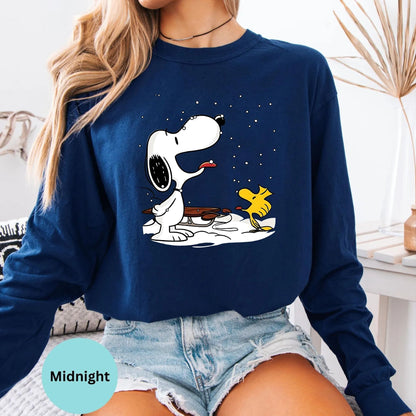 Midnight long sleeve woman wearing Snoopy and Woodstock sitting graphic