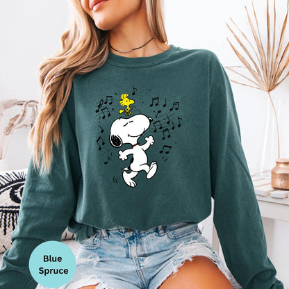 Blue Spruce long sleeve woman wearing dancing Snoopy graphic