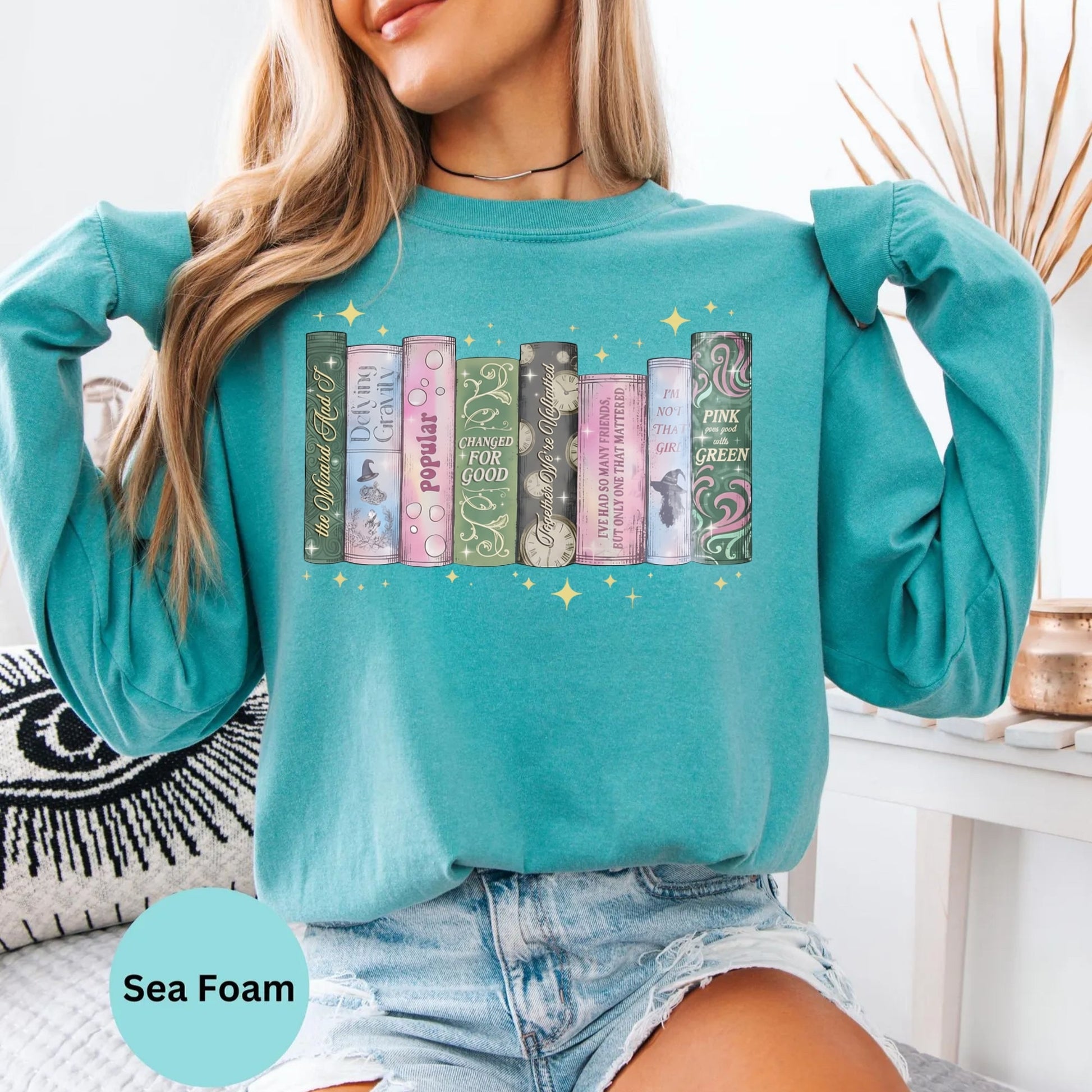 Comfort Colors long sleeve shirt in Seafoam with book spine graphic.