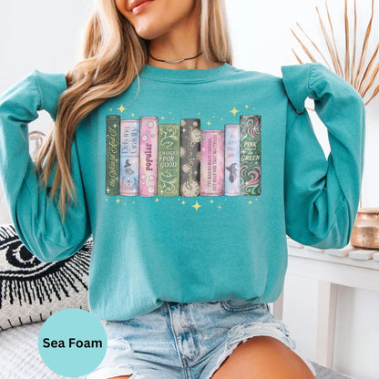 Comfort Colors long sleeve shirt in Seafoam with book spine graphic.