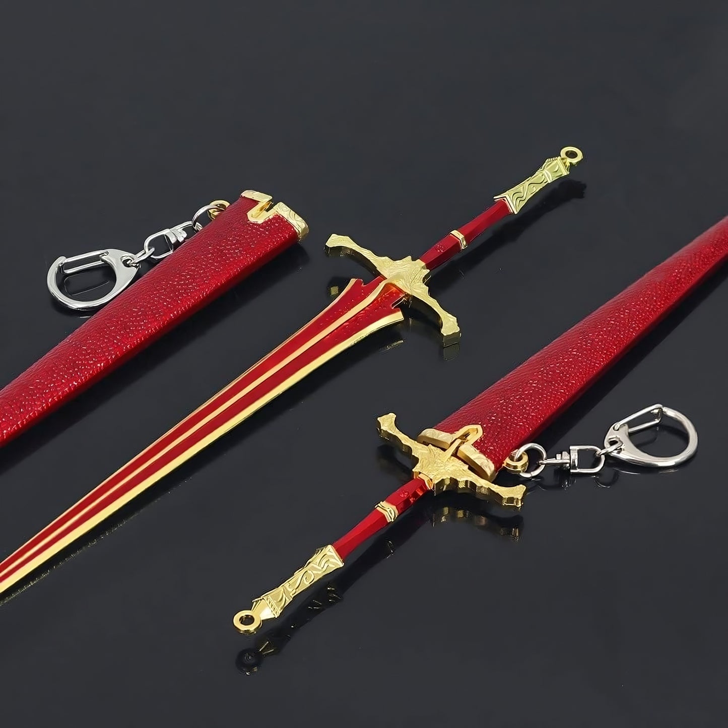 Mini medieval sword and scabbard replica with keychain on black surface