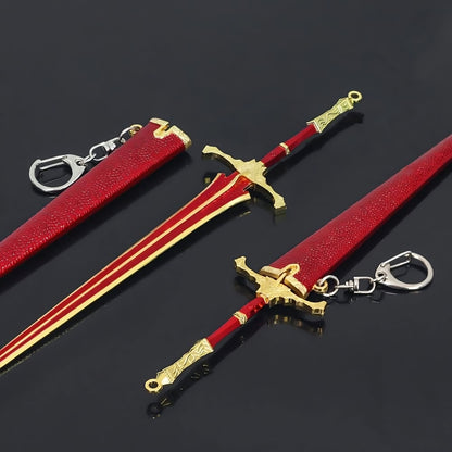 Mini medieval sword and scabbard replica with keychain on black surface