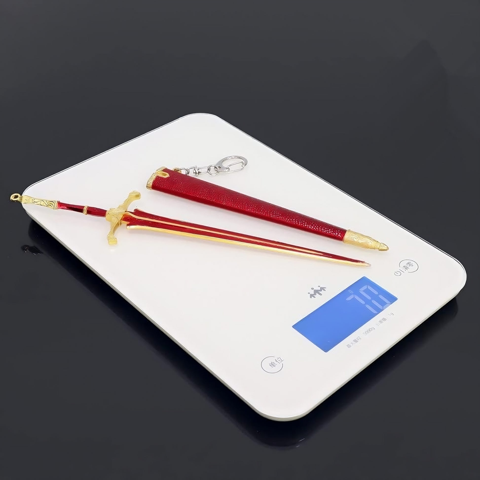 Mini greatsword replica placed on digital scale showing lightweight size