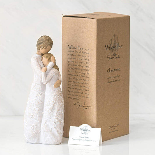 Willow Tree figurine of a woman hugging a child with packaging on a white background