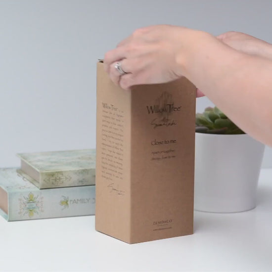 Unboxing hand-painted close to me figurine showing gift box packaging