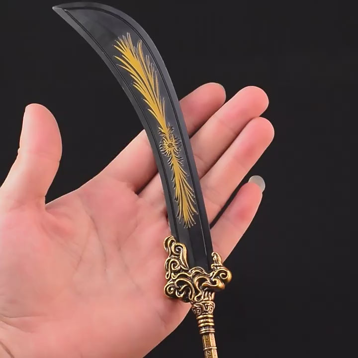Handheld Greatsword of Radahn keychain miniature with curved blade and gold detailing