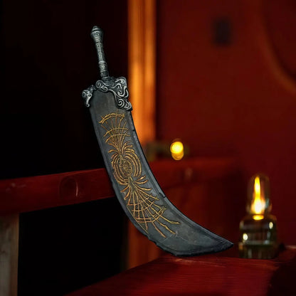 Greatsword of Radahn keychain replica standing on wooden surface
