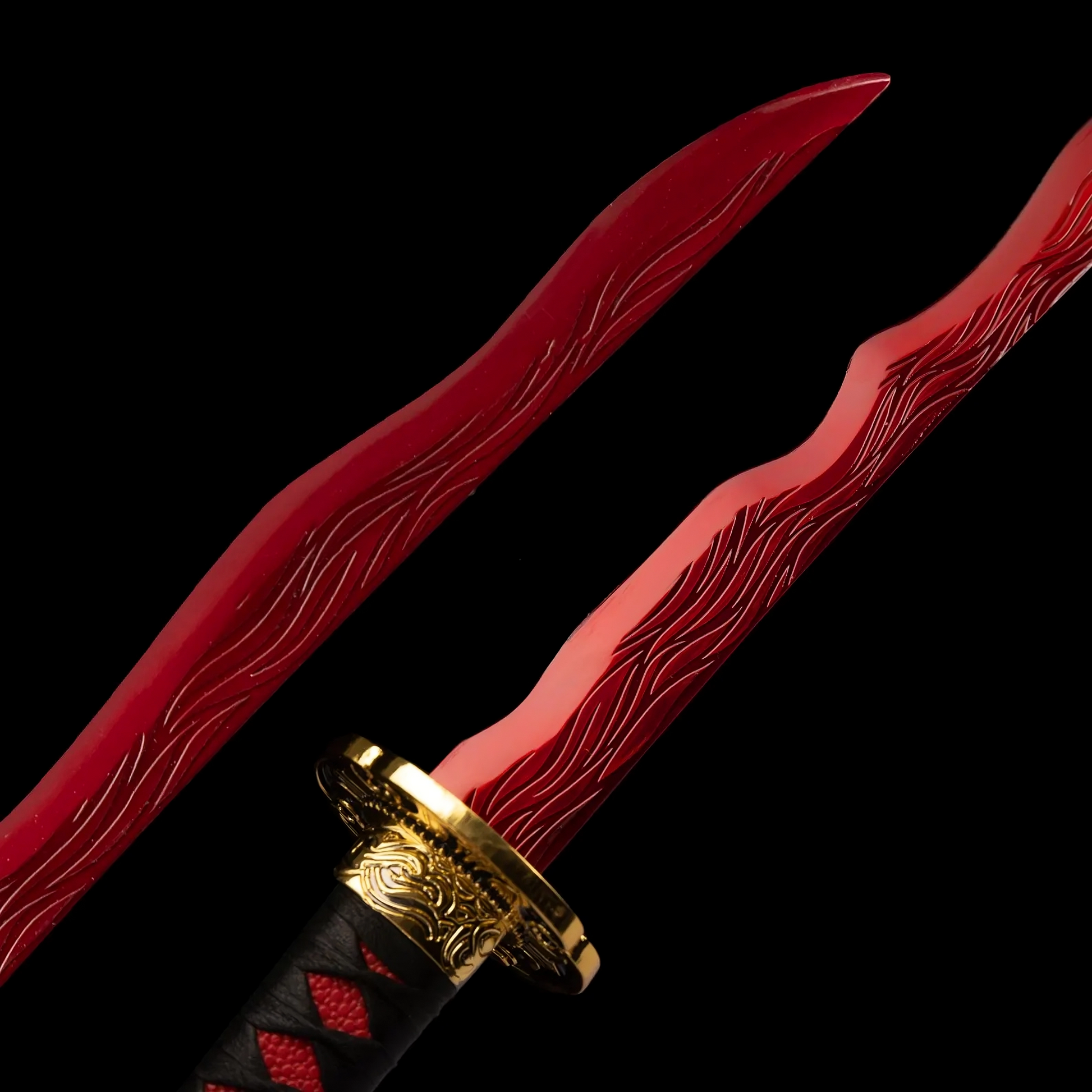 Vertical close-up of the red textured blade, wavy design.