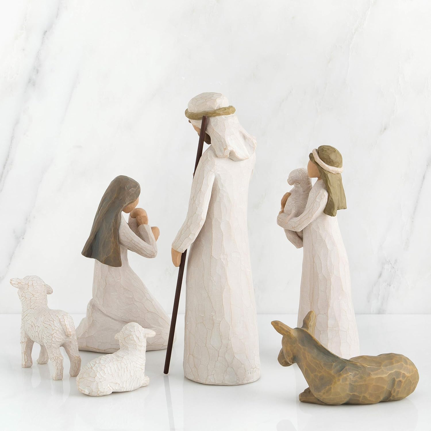 Nativity scene figurines on a white background