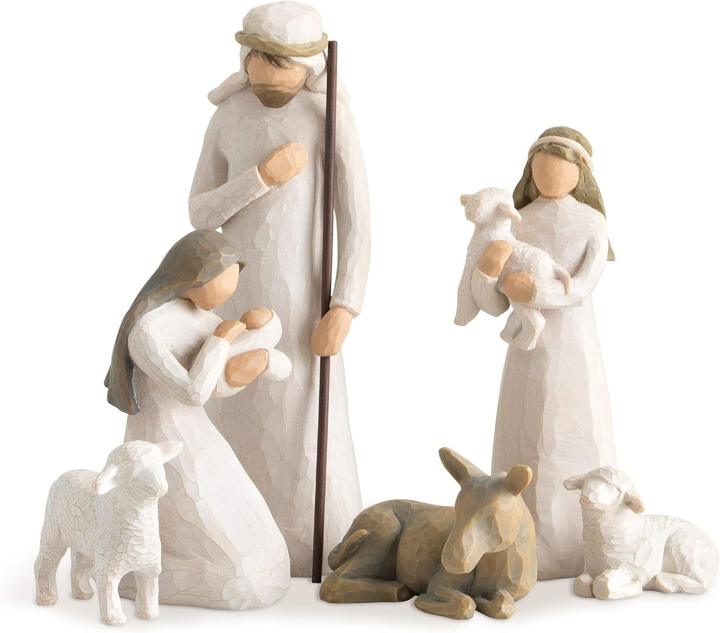 Nativity scene figurines with Mary, Joseph, and baby Jesus on a white background