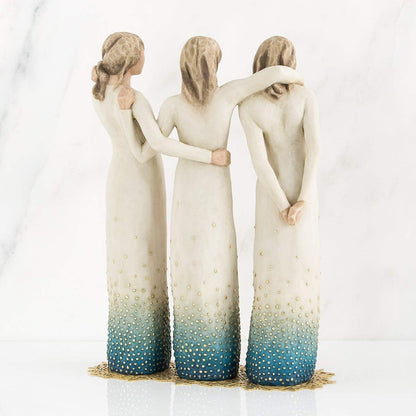 Three figures with ombre dresses and textured bodies on a white background