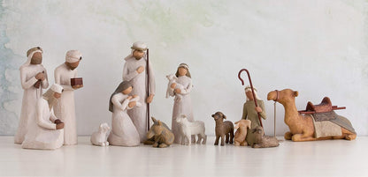 Nativity scene figurines on a light background