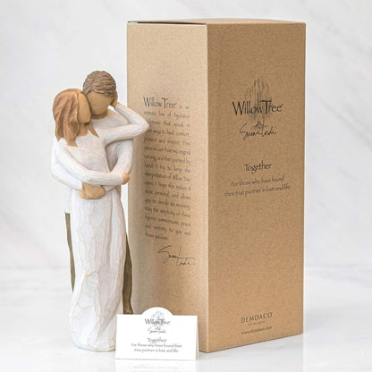 Willow Tree figurine of two people embracing with packaging and card on a white background